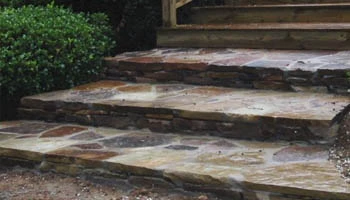 Natural stone walkway and steps installed in Jackson, MS home by Ambiance Landscape.